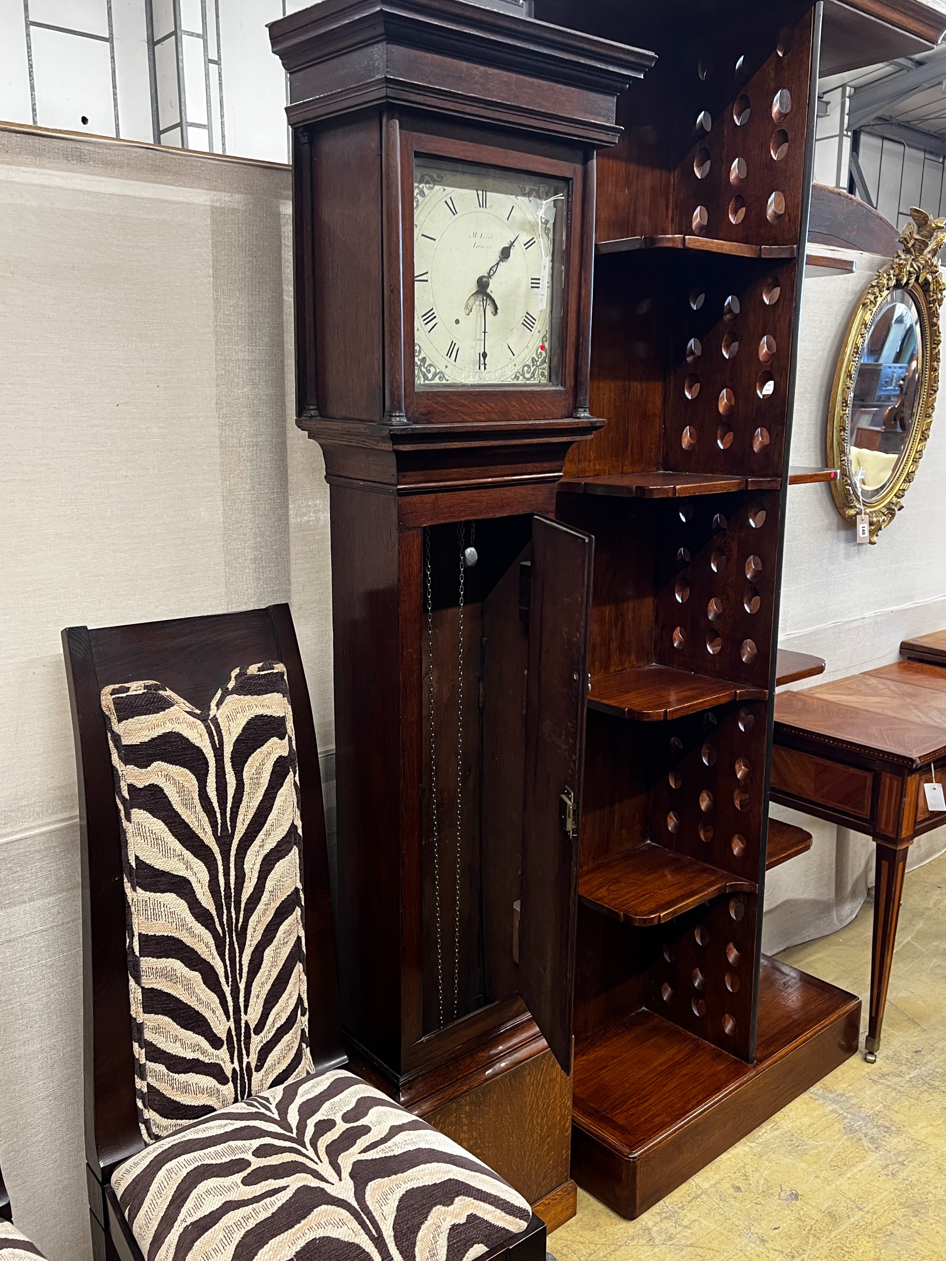 An early 19th century oak 30 hour longcase clock marked M. Irish, Lewes, height 196cm